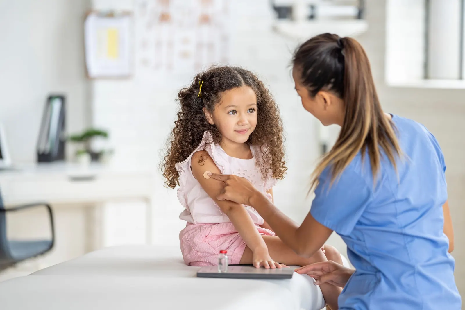 Doctor consulting with a young patient